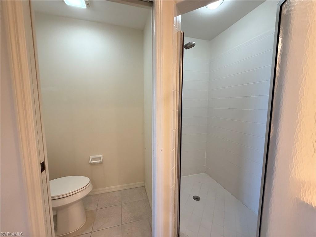 Bathroom featuring a stall shower and light tile patterned floors