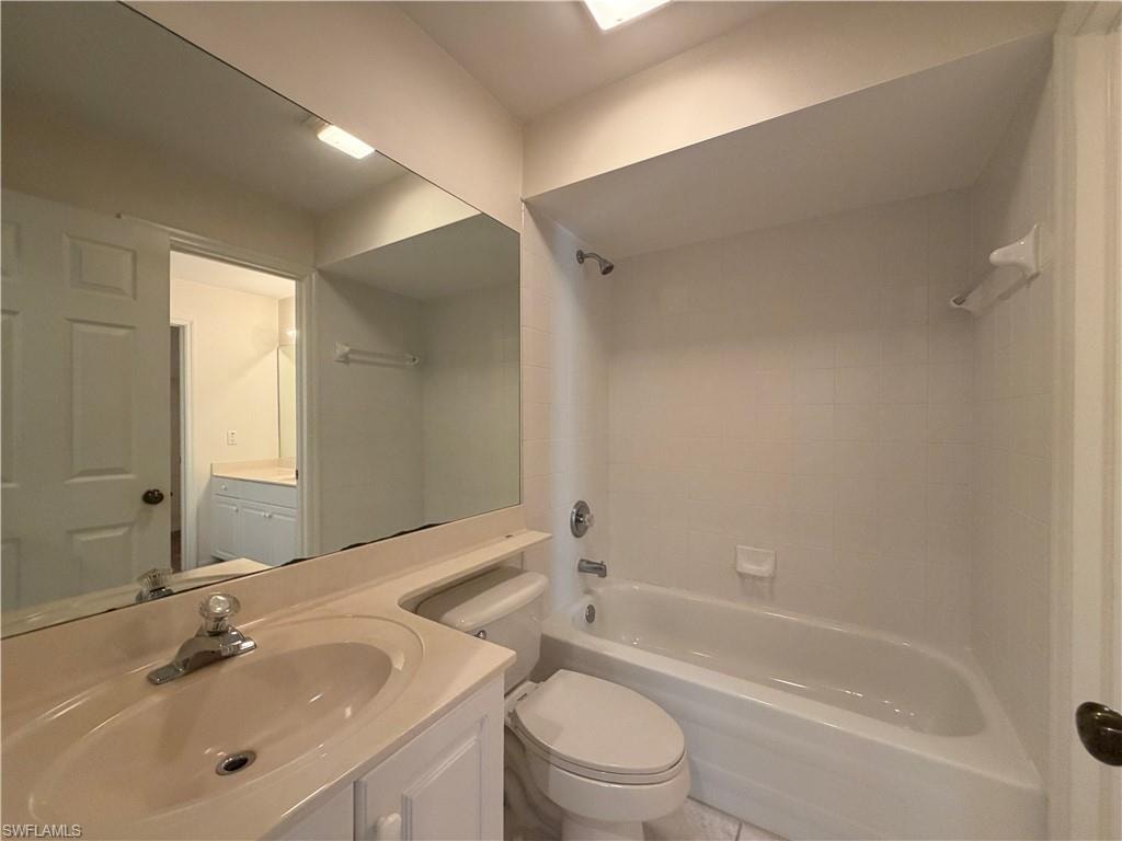 Bathroom featuring vanity and shower / bathtub combination