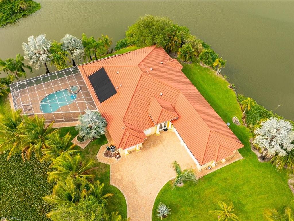 Aerial view of property and surrounding area with a pool area
