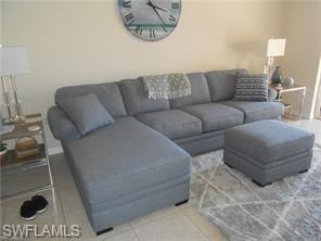 Living area featuring light tile patterned floors