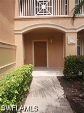 Doorway to property featuring stucco siding