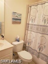 Bathroom featuring vanity and a shower with shower curtain