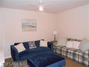 Living room featuring wood finished floors and a ceiling fan