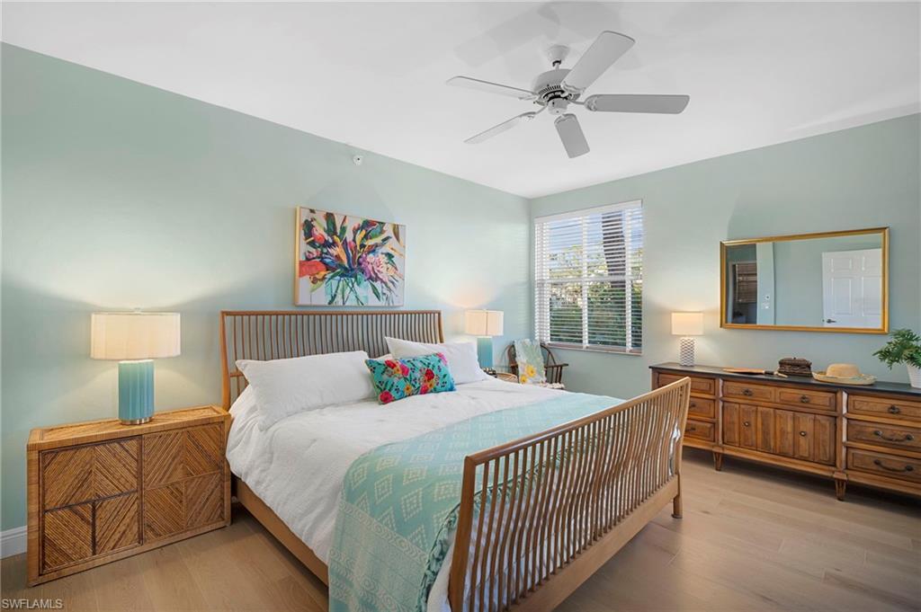Bedroom featuring Mirage wood floors floors and a ceiling fan