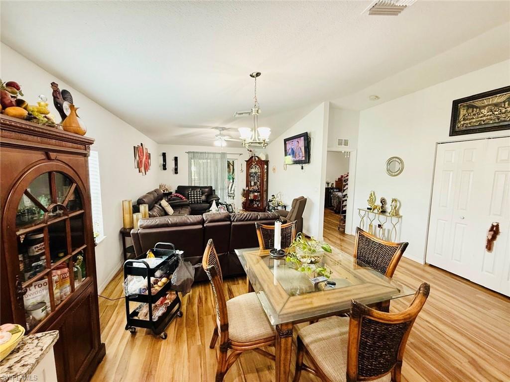 Dining space featuring light wood-style floors and a ceiling fan