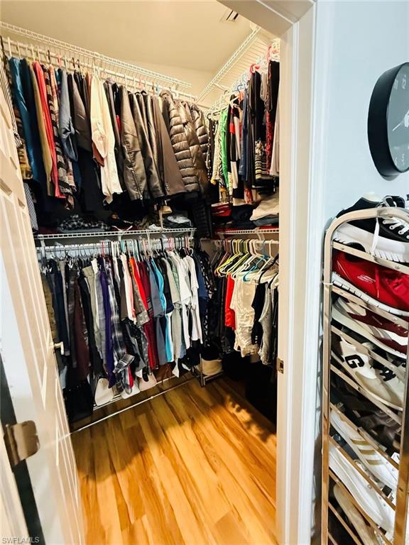 Spacious closet featuring wood finished floors