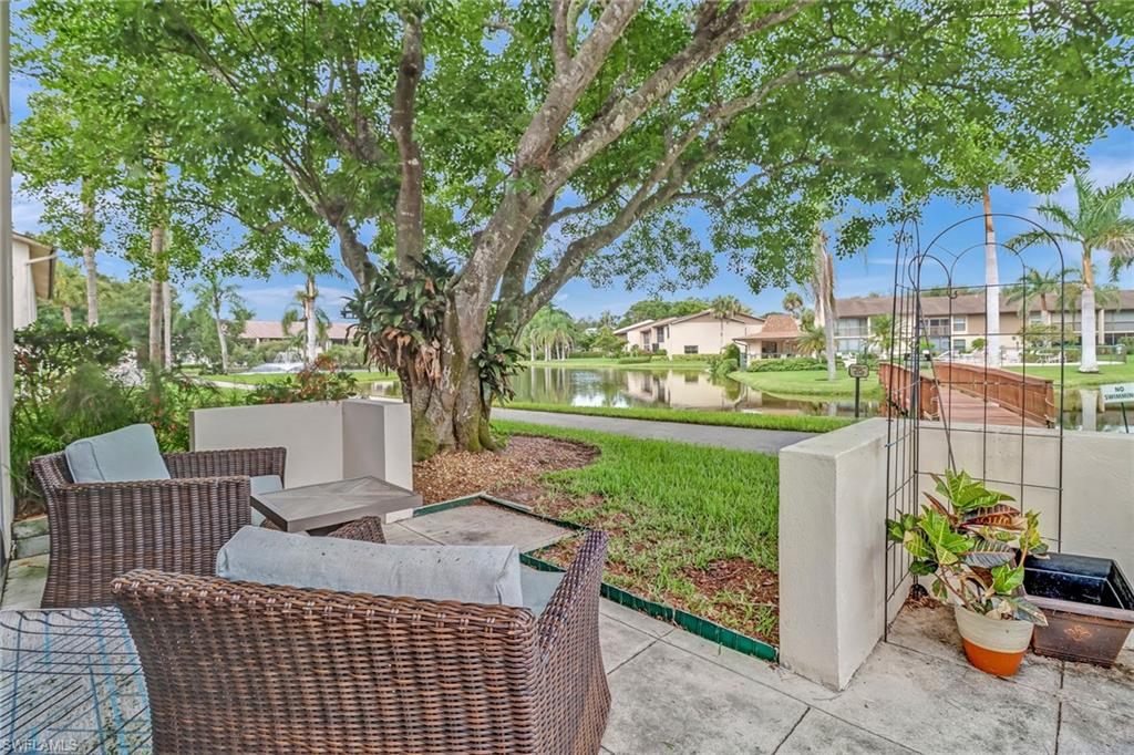 View of patio / terrace featuring a water view and a residential view