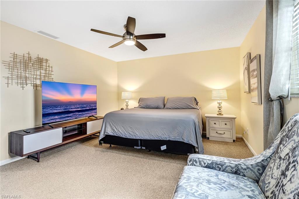 Bedroom featuring carpet floors and ceiling fan