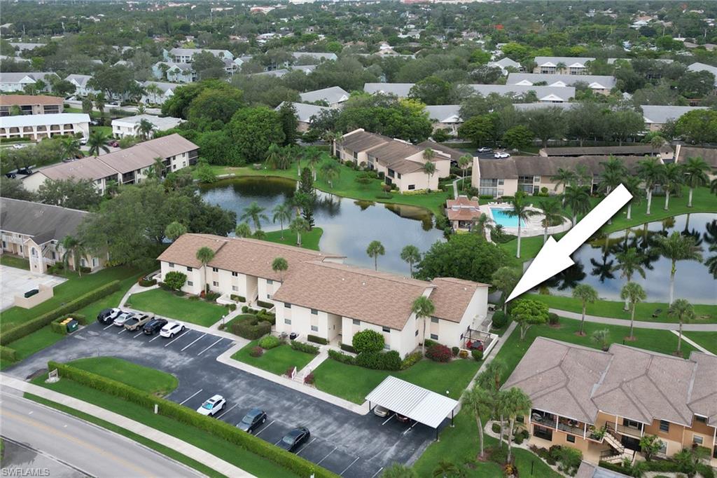 Aerial view of residential area featuring a large body of water