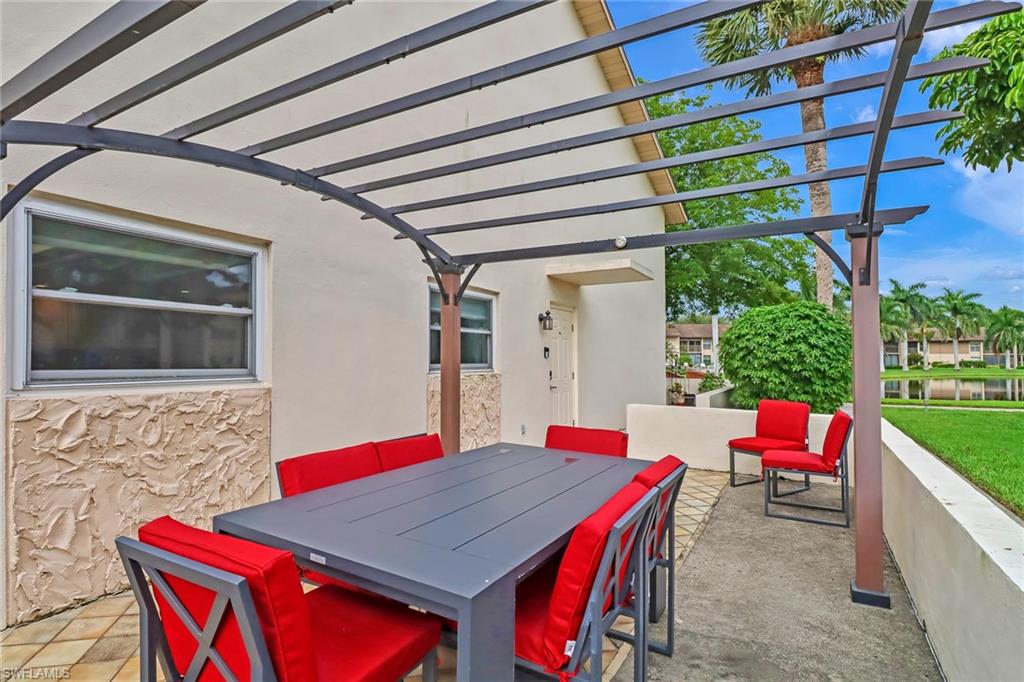 View of patio / terrace featuring outdoor dining space and a pergola