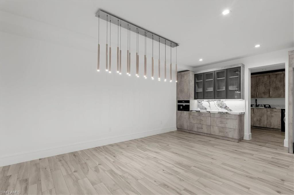 Unfurnished bedroom featuring light wood-style floors and recessed lighting