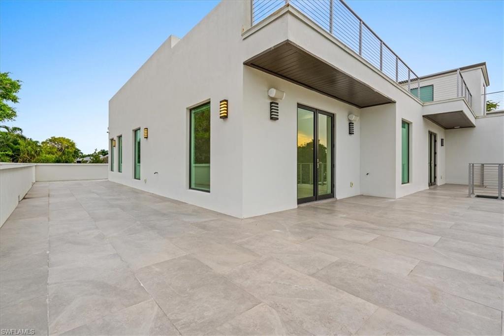 Back of house featuring a patio and stucco siding