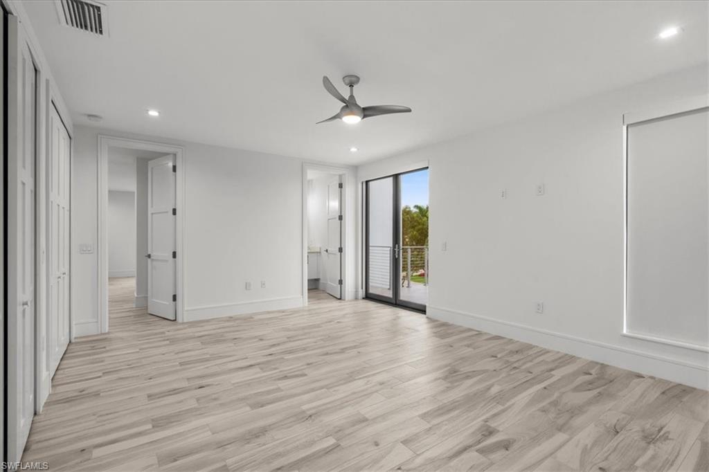 Unfurnished bedroom with recessed lighting, light wood-style flooring, access to outside, and a ceiling fan