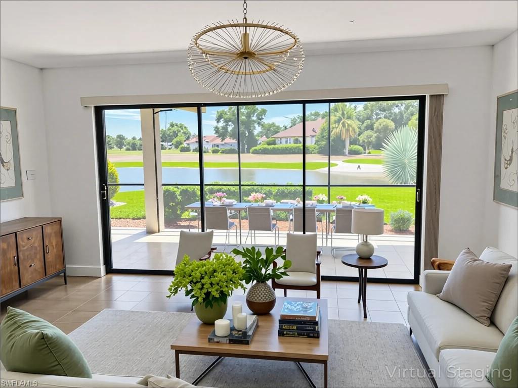 Living area with tile patterned floors, plenty of natural light, and a water view