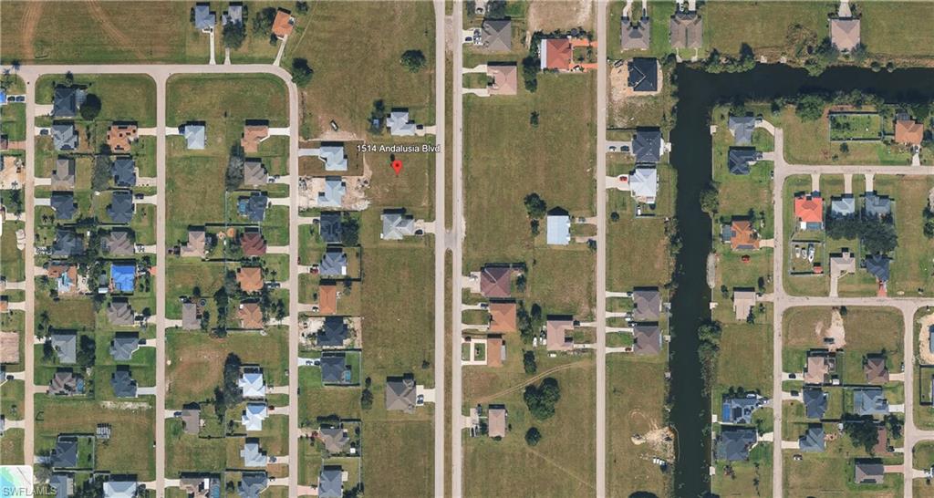 Aerial overview of property's location with nearby suburban area