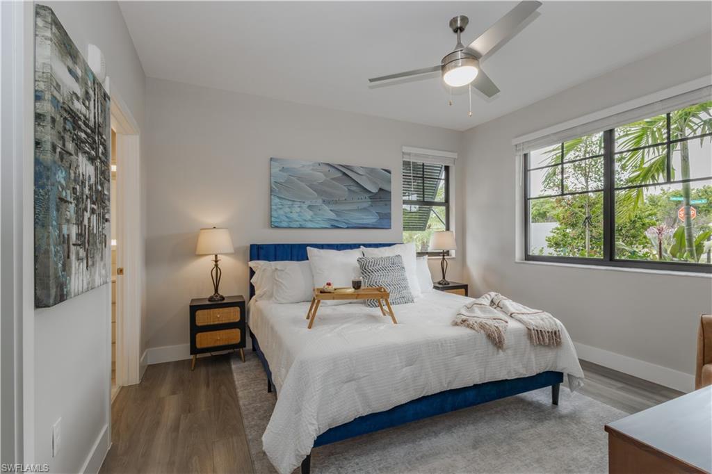 Bedroom with wood finished floors and a ceiling fan
