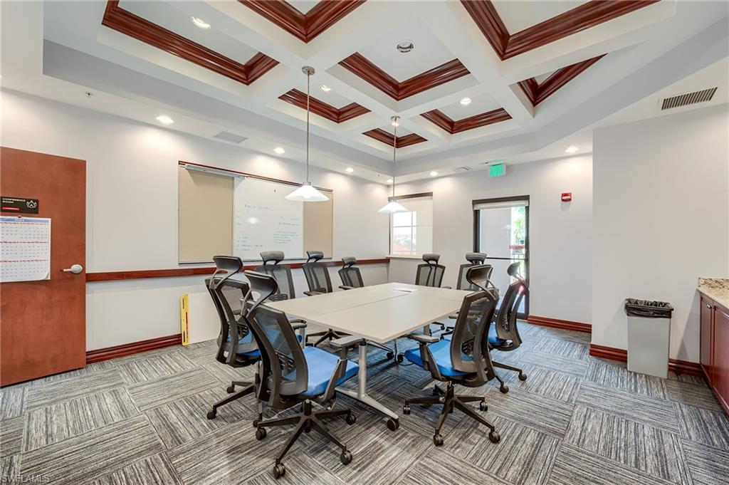 Office area featuring coffered ceiling, recessed lighting, beamed ceiling, and crown molding