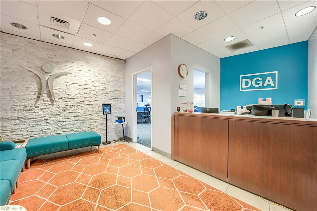 Reception area with a paneled ceiling and recessed lighting