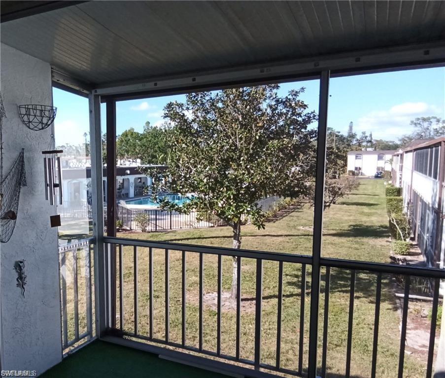 Balcony with view of pool