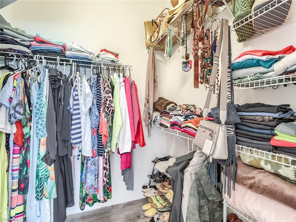 Spacious closet featuring wood finished floors