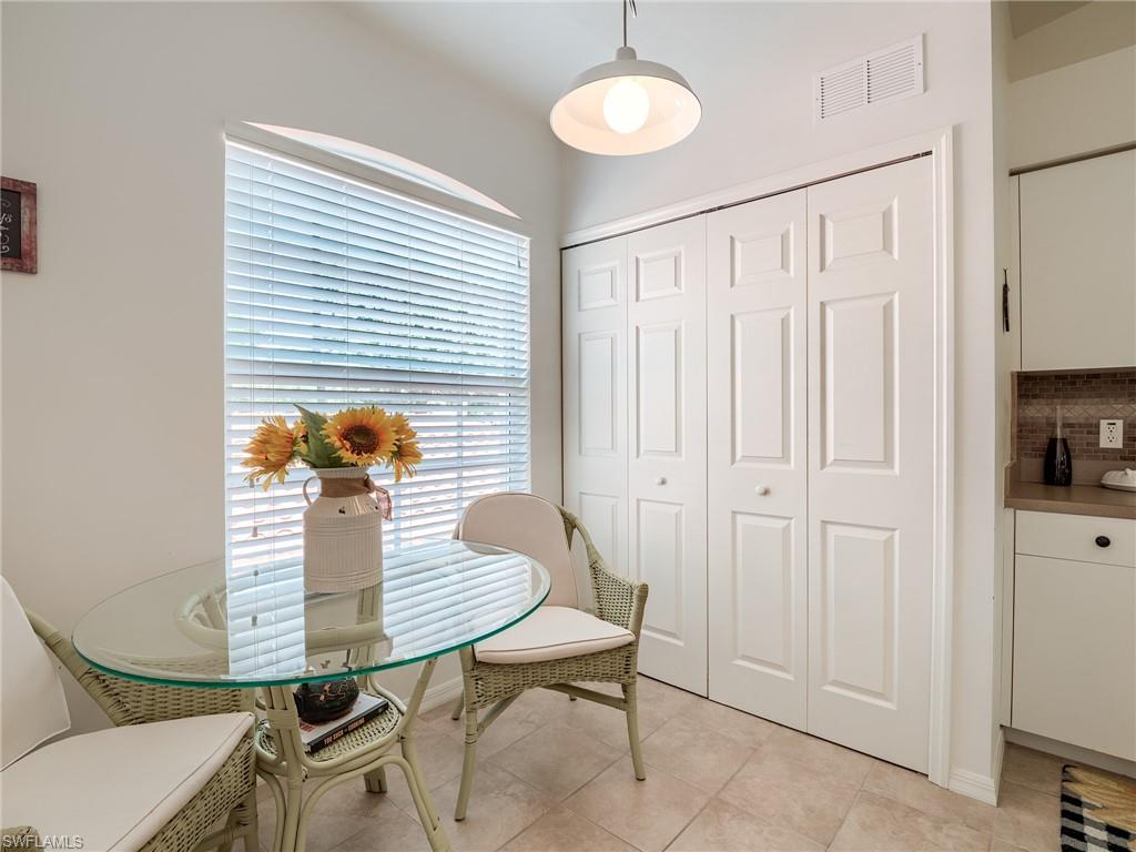Dining room with light tile patterned flooring