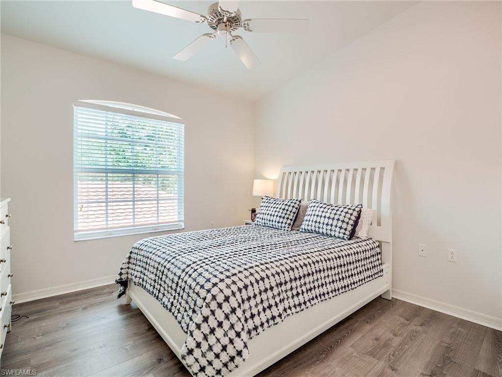 Bedroom with wood finished floors and ceiling fan