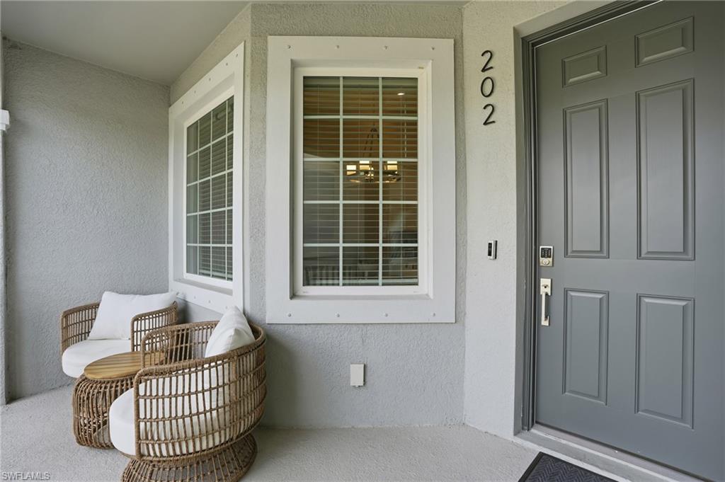 View of exterior entry with stucco siding