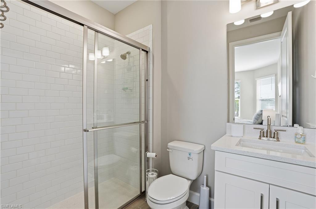 Ensuite bathroom with vanity and a shower stall