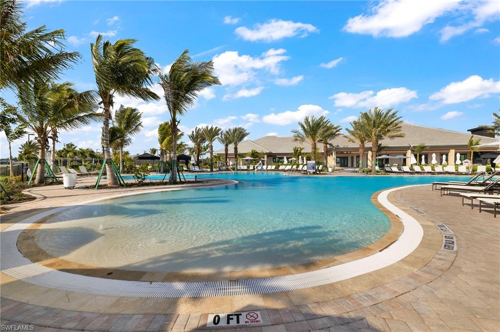 Community pool with a patio area