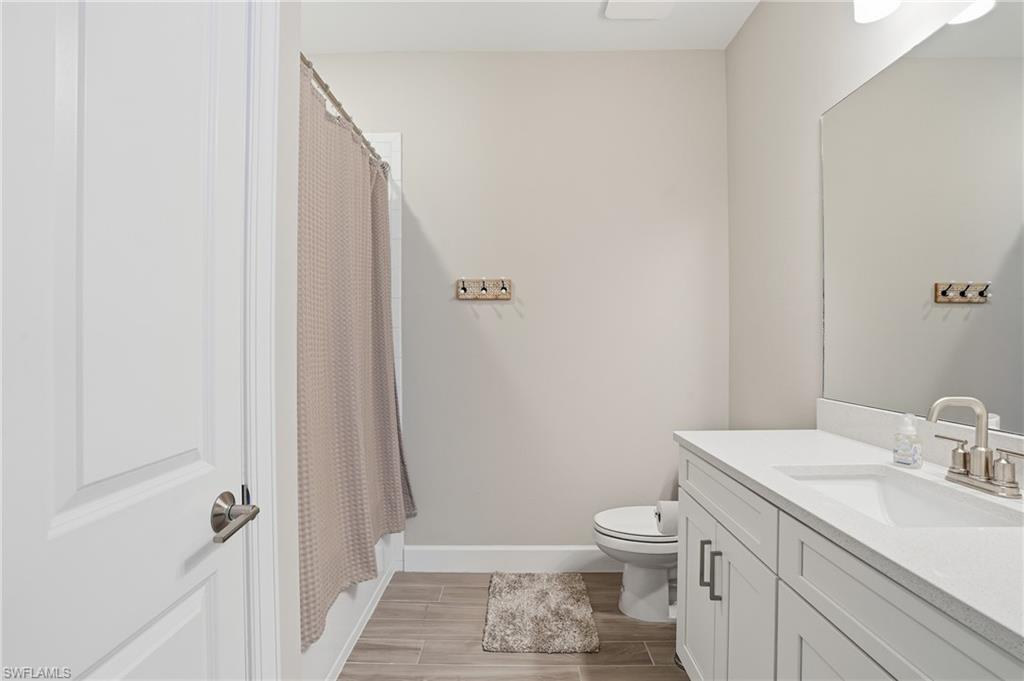 Bathroom featuring wood finish floors and vanity