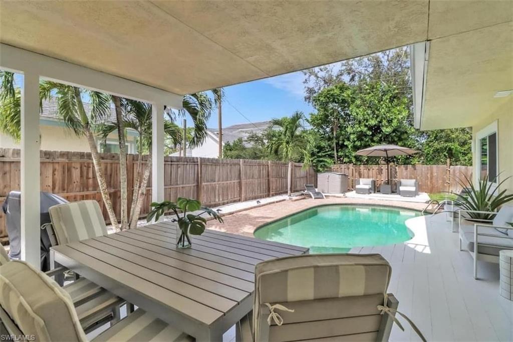 View of swimming pool with a patio area