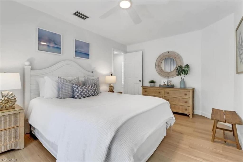 Bedroom with light hardwood / wood-style flooring and ceiling fan