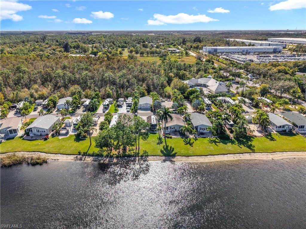 Aerial perspective of suburban area with a nearby body of water
