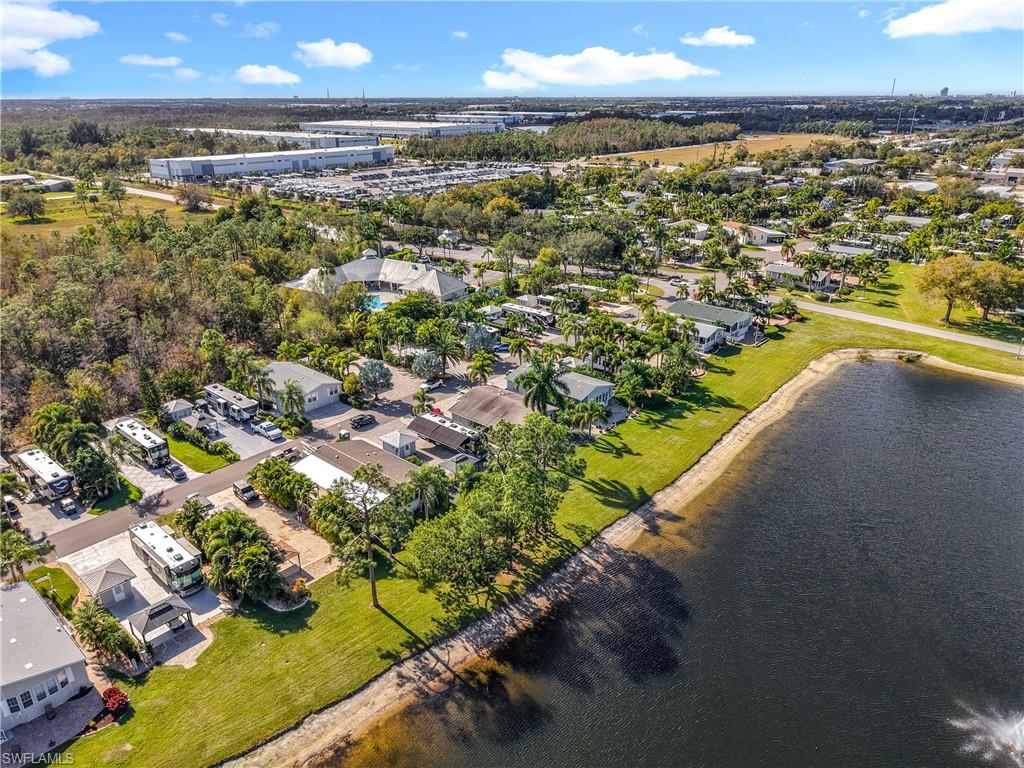 Aerial perspective of suburban area with a nearby body of water