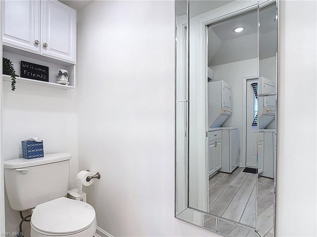 Bathroom with toilet and wood tiled floors