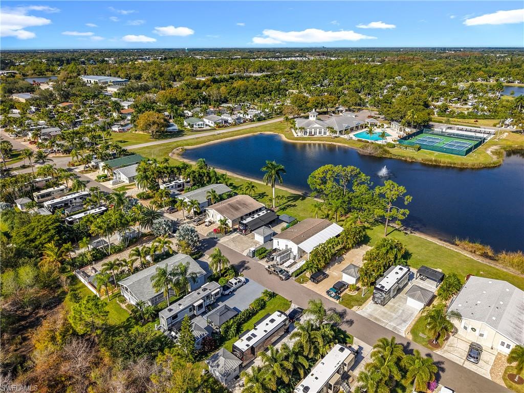 Aerial perspective of suburban area with a nearby body of water