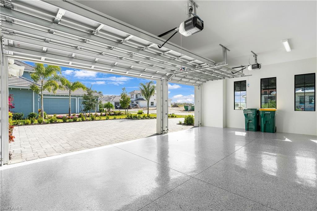 Garage featuring a garage door opener