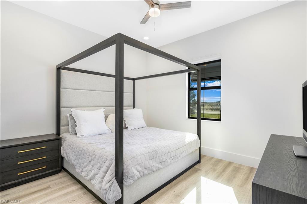 Bedroom featuring light wood-style flooring and ceiling fan