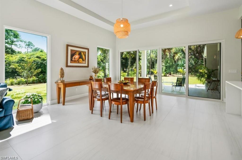 Dining room with plenty of natural light and a raised ceiling
