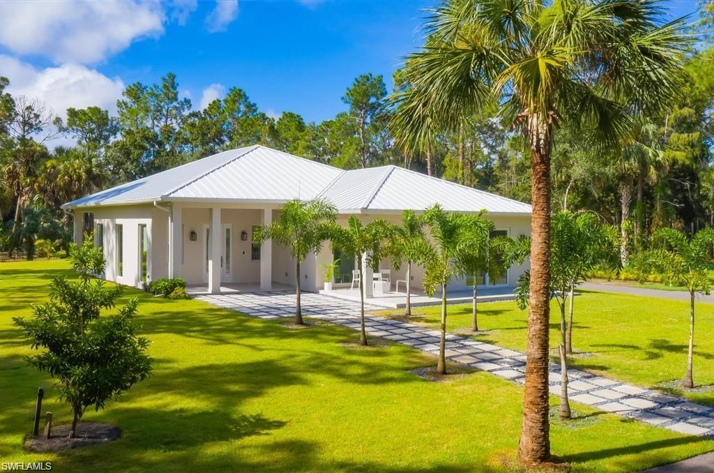 View of community featuring a yard and a patio area