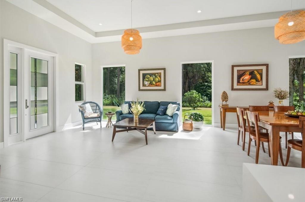 Living room featuring baseboards and a tray ceiling
