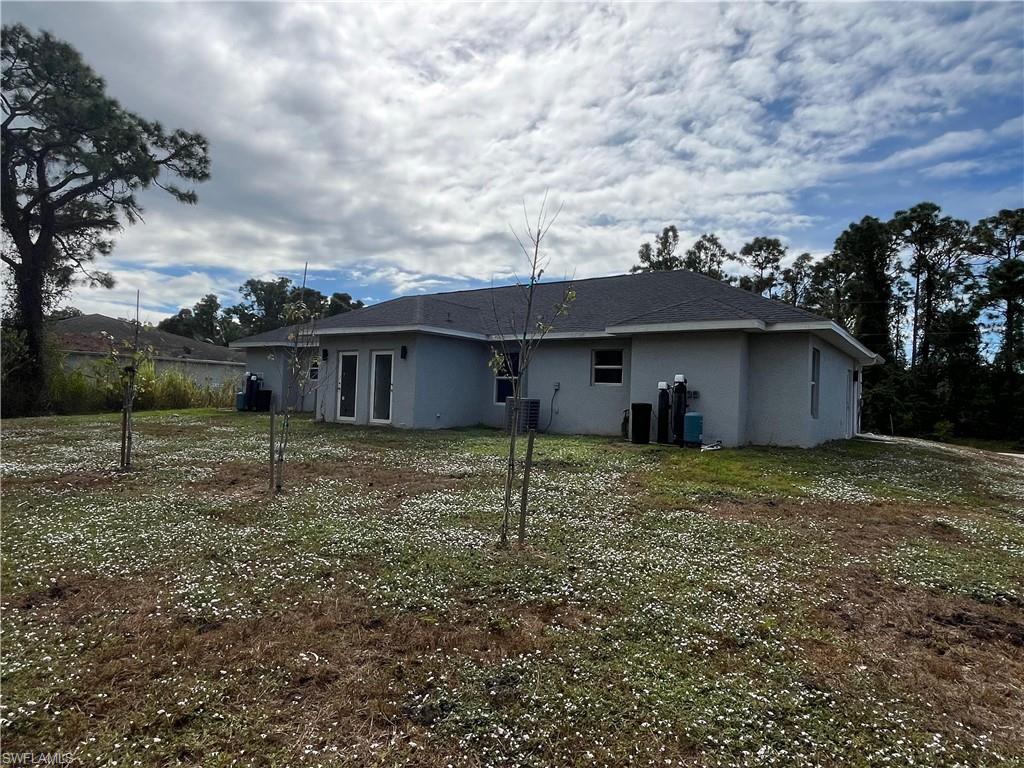 Back of property with stucco siding