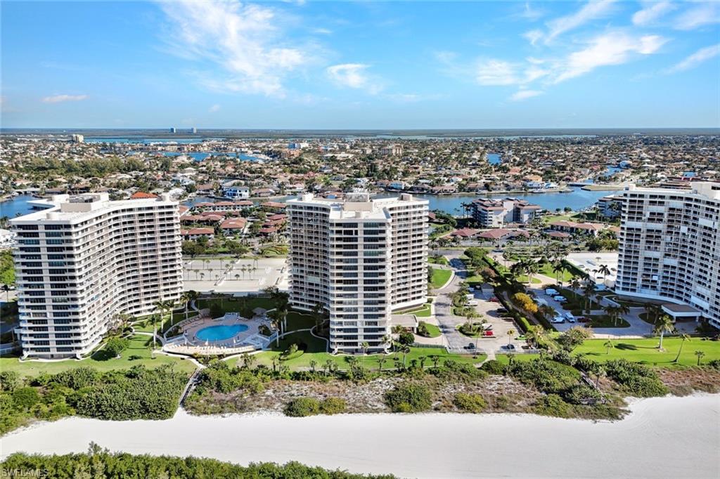 View of urban area featuring a nearby body of water and apartment complex