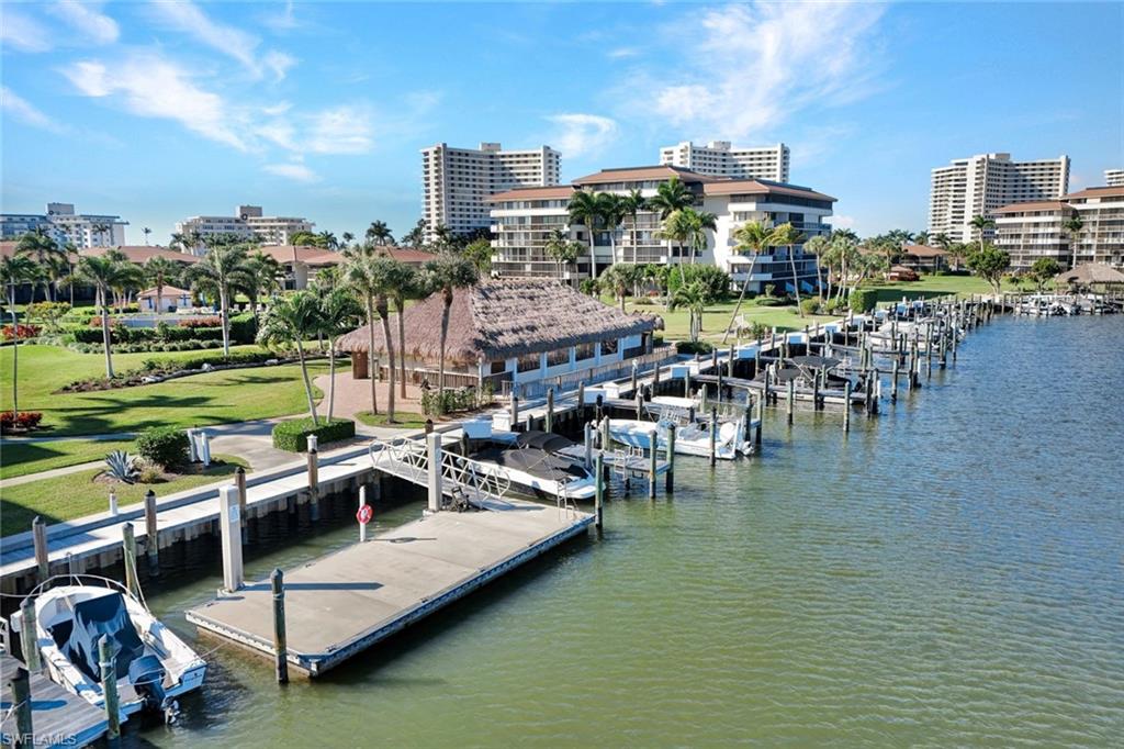 Dock area featuring a water view and boat lift