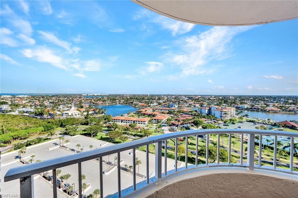 Balcony with a water view and a city view