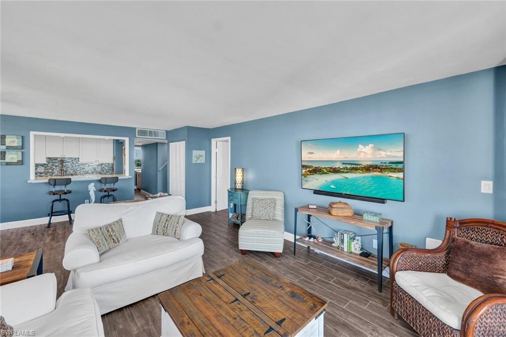 Living room with wood finish floors and baseboards
