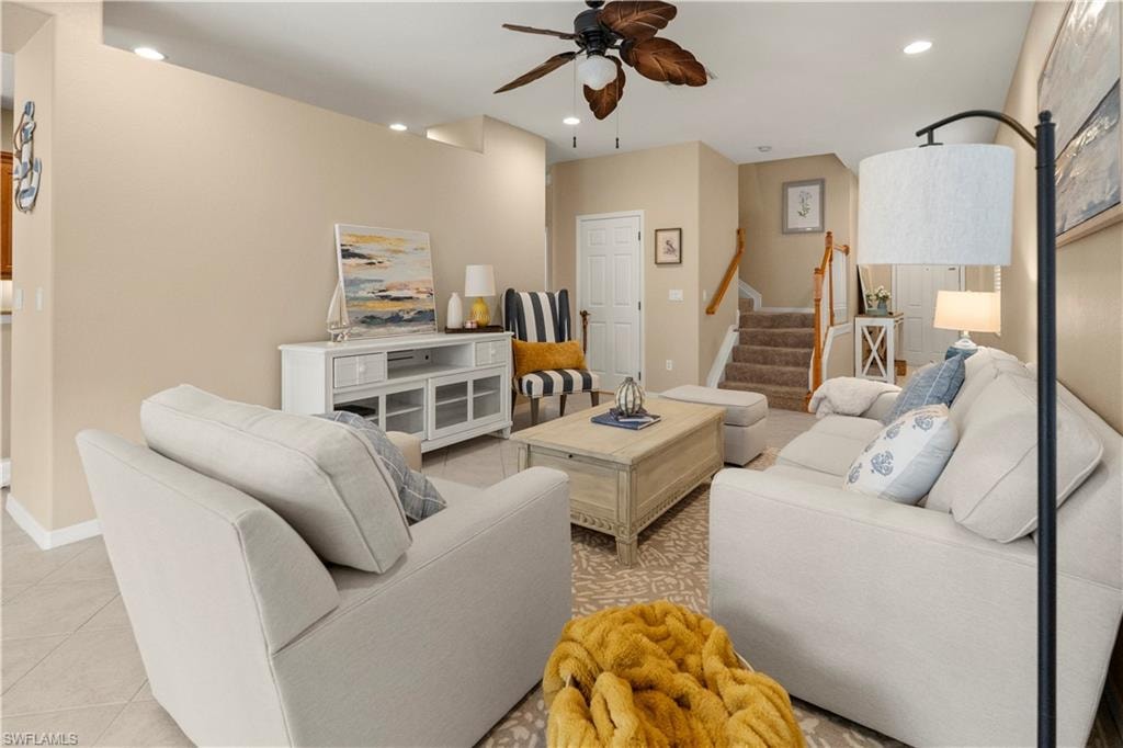 Living room featuring recessed lighting, stairway, a ceiling fan, and light tile patterned floors