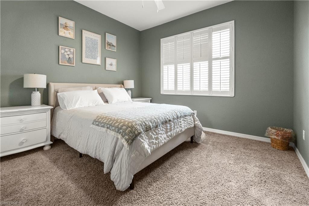 Bedroom featuring carpet floors and ceiling fan