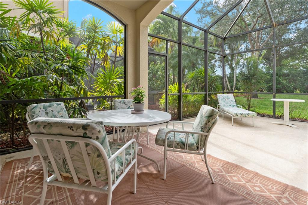 Sunroom with a patio and outdoor dining area