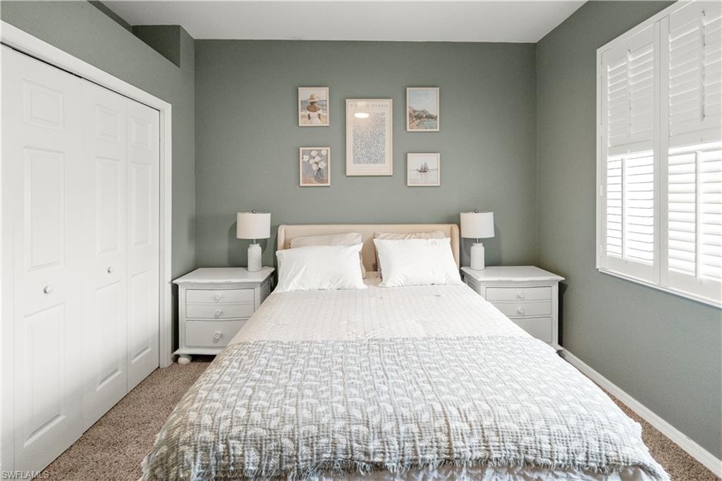 Bedroom with carpet flooring and a closet